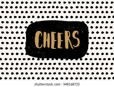 Typographic design greeting card template with hand drawn dots background in black and cream and text "Cheers" in golden yellow.