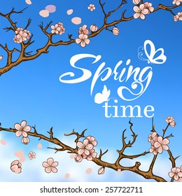 Typographic Design. Lettering Spring design on blurred background with butterflies and cherry blossom or sakura.