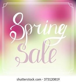 Typographic Design. Lettering Spring design on blurred background.Advertisement about the spring sale on defocused background