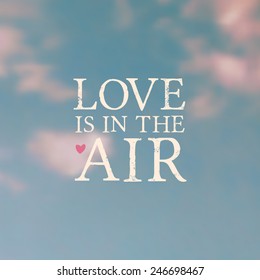 Typographic design on a blurred vintage sky background. "Love Is in the Air" message. EPS10 file, gradient mesh used.
