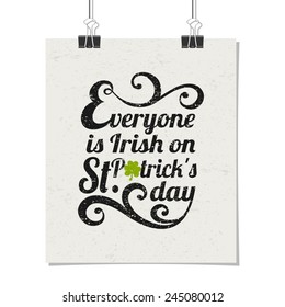 Typographic style poster for St. Patrick's Day with message Everyone is Irish on St. Patrick's Day. Poster design mock-up with paper clips, isolated on white.