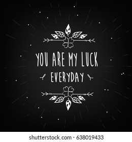 Typographical inscription "Get lucky". Sketch of handmade drawing. Clover leaf.  Dark grunge background.