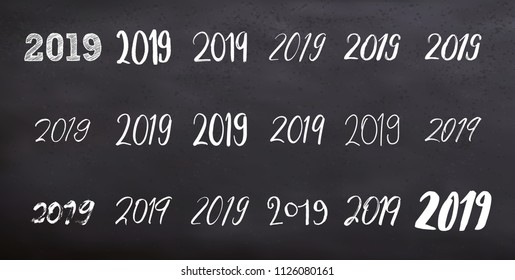 Typography set with calligraphy for 2019 Happy New Year isolated on blackboard. Vector illustration. New year numbers quote