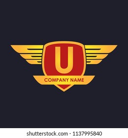 U initial shield with wings gold color logo