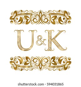 U and K vintage initials logo symbol. The letters are surrounded by ornamental elements. Wedding or business partners monogram in royal style.
