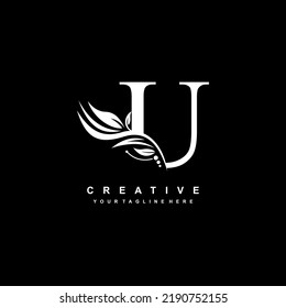 U letter logo vector design with leaf decoration. monogram U, typography. feather logo. luxury U. U flourish. suitable for logo of business, company, product, boutique, wedding, hotel, etc