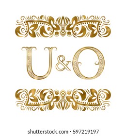 U and O vintage initials logo symbol. The letters are surrounded by ornamental elements. Wedding or business partners monogram in royal style.