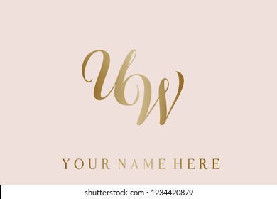 U and W monogram logo.Calligraphic style lettering icon in gold metallic color.Typographic sign with elegant letter U and letter W, isolated on light pink background.