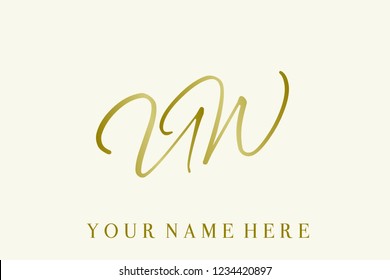U and W monogram.Calligraphic style lettering icon in gold metallic color.Typographic logo with elegant script letter U and letter W, isolated on light background.