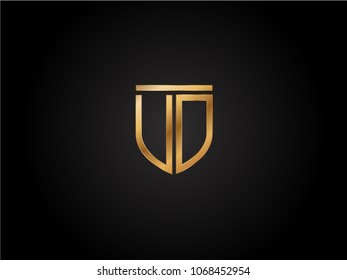 UD shield shape Letter Design in gold color
