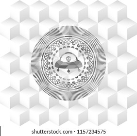 ufo with alien inside icon inside retro style grey emblem with geometric cube white background