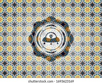 ufo with aline inside icon inside arabesque style badge. arabic decoration.