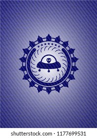 ufo with aline inside icon inside badge with jean texture