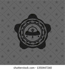 ufo with aline inside icon inside black badge