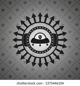 ufo with aline inside icon inside black emblem