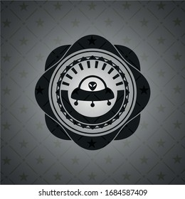 ufo with aline inside icon inside black emblem