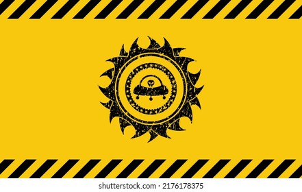 ufo with aline inside icon black grunge emblem inside yellow warning sign. Vector Illustration. Detailed. 