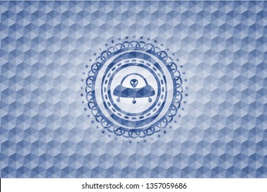 ufo with aline inside icon inside blue badge with geometric background.