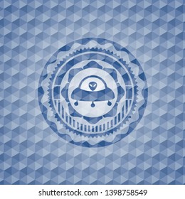 ufo with aline inside icon inside blue hexagon emblem.
