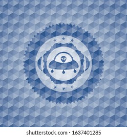 ufo with aline inside icon inside blue hexagon emblem.