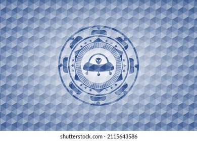 ufo with aline inside icon inside blue emblem with geometric pattern background. 