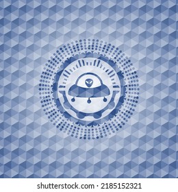 ufo with aline inside icon inside blue emblem or badge with abstract geometric pattern background. 