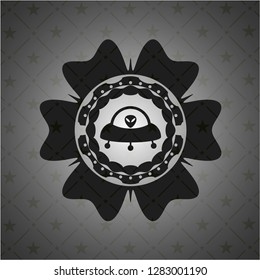 ufo with aline inside icon inside dark emblem