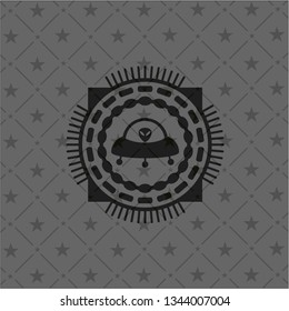 ufo with aline inside icon inside dark emblem. Retro