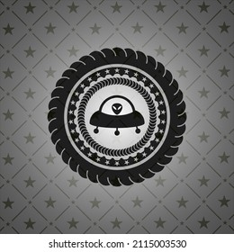 ufo with aline inside icon inside dark badge. 