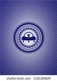 ufo with aline inside icon inside emblem with jean background