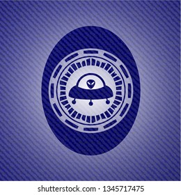 ufo with aline inside icon inside emblem with jean background