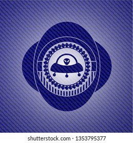 ufo with aline inside icon inside emblem with jean background