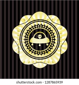 ufo with aline inside icon inside gold badge or emblem