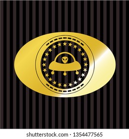 ufo with aline inside icon inside gold emblem or badge
