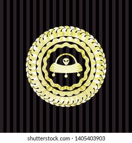 ufo with aline inside icon inside gold badge or emblem