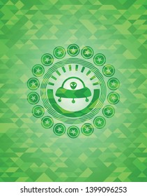 ufo with aline inside icon inside green emblem with mosaic background