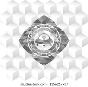 ufo with aline inside icon inside grey emblem with cube white background