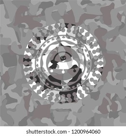 ufo with aline inside icon inside grey camouflage emblem