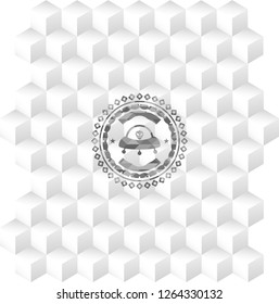ufo with aline inside icon inside grey emblem with geometric cube white background