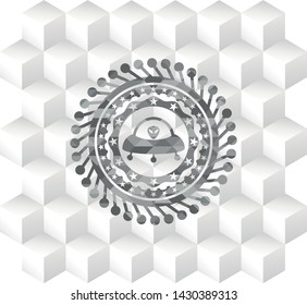 ufo with aline inside icon inside grey icon or emblem with geometric cube white background