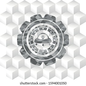ufo with aline inside icon inside grey emblem with geometric cube white background