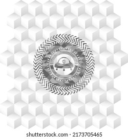 ufo with aline inside icon inside grey icon or emblem with geometric cube white background. 