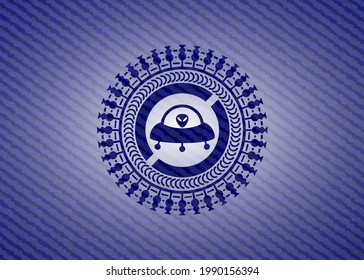 ufo with aline inside icon inside jean background. 
