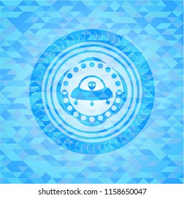ufo with aline inside icon inside light blue emblem with mosaic background