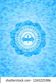 ufo with aline inside icon inside light blue mosaic emblem