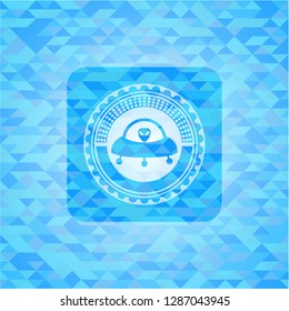 ufo with aline inside icon inside light blue emblem with triangle mosaic background