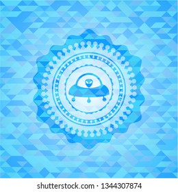 ufo with aline inside icon inside light blue mosaic emblem