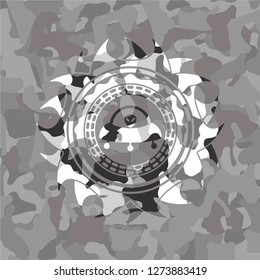 ufo with aline inside icon on grey camouflaged pattern