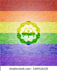 ufo with aline inside icon on mosaic background with the colors of the LGBT flag