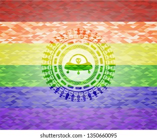 ufo with aline inside icon on mosaic background with the colors of the LGBT flag